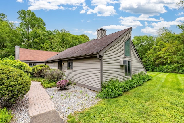 23A Yankee Glen Dr Unit 23A, Madison, CT 06443 - view of side of property with a chimney, a yard, and roof with shingles