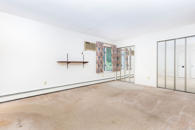 23A Yankee Glen Dr Unit 23A, Madison, CT 06443 - unfurnished bedroom featuring carpet floors, an AC wall unit, and baseboard heating