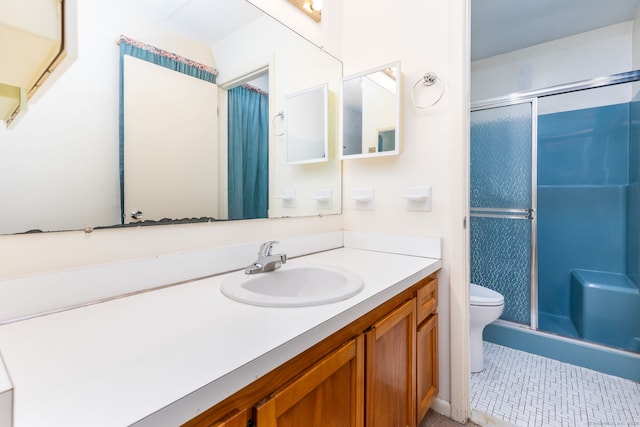 23A Yankee Glen Dr Unit 23A, Madison, CT 06443 - bathroom featuring a stall shower, toilet, vanity, and tile patterned floors