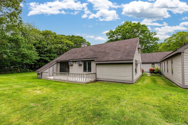 23A Yankee Glen Dr Unit 23A, Madison, CT 06443 - back of property featuring a chimney, a lawn, a wooden deck, and roof with shingles