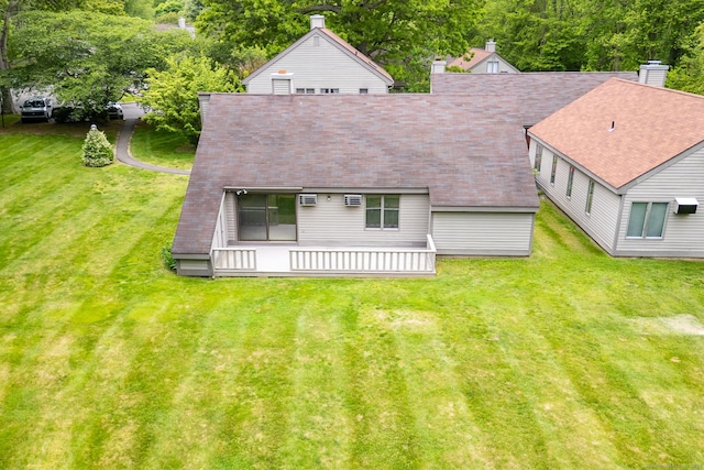23A Yankee Glen Dr Unit 23A, Madison, CT 06443 - back of house featuring a chimney, a lawn, and roof with shingles