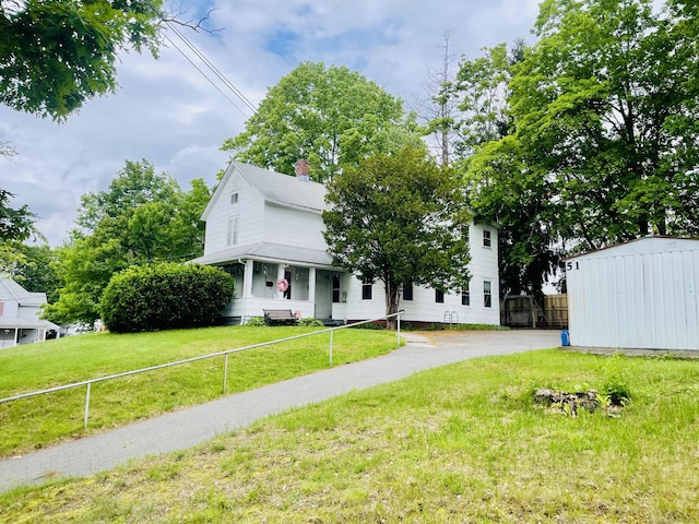 51 Cooper St, Manchester, CT 06040 - view of front facade featuring a chimney