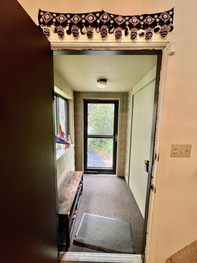225 Ledge Dr, Torrington, CT 06790 - doorway to outside featuring carpet flooring