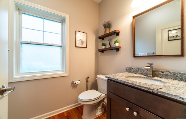 2 Redwood Ln, Southington, CT 06489 - half bathroom featuring wood finished floors, vanity, toilet, and baseboards
