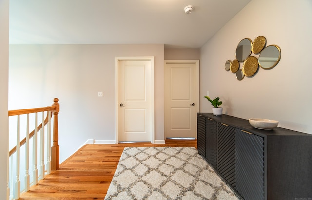 2 Redwood Ln, Southington, CT 06489 - hallway with wood finished floors, an upstairs landing, and baseboards