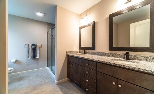 2 Redwood Ln, Southington, CT 06489 - bathroom with a shower stall, double vanity, baseboards, and toilet