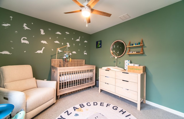 2 Redwood Ln, Southington, CT 06489 - carpeted bedroom featuring a crib, baseboards, and ceiling fan