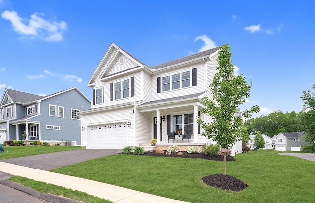 2 Redwood Ln, Southington, CT 06489 - view of front of home with a porch, asphalt driveway, a garage, a front yard, and central AC unit