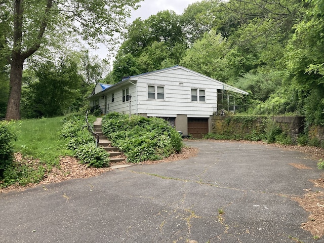 84 Huntingtown Rd, Newtown, CT 06470 - view of property exterior featuring asphalt driveway