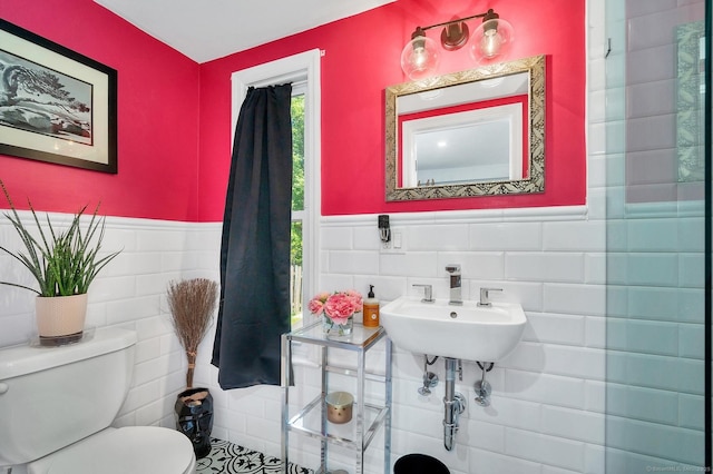 35 Deer Hill Ave, Danbury, CT 06810 - bathroom featuring tile walls, toilet, a sink, and wainscoting