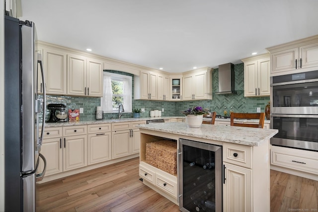 35 Deer Hill Ave, Danbury, CT 06810 - kitchen with wine cooler, stainless steel appliances, cream cabinetry, wall chimney exhaust hood, and recessed lighting