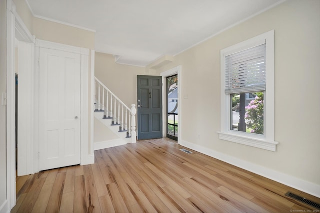 35 Deer Hill Ave, Danbury, CT 06810 - entrance foyer with light wood-type flooring, stairway, healthy amount of natural light, ornamental molding, and baseboards