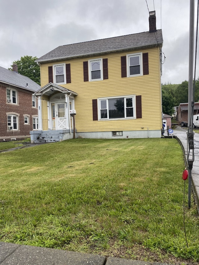 624 S Main St, Torrington, CT 06790 - view of front facade featuring a chimney and a front yard