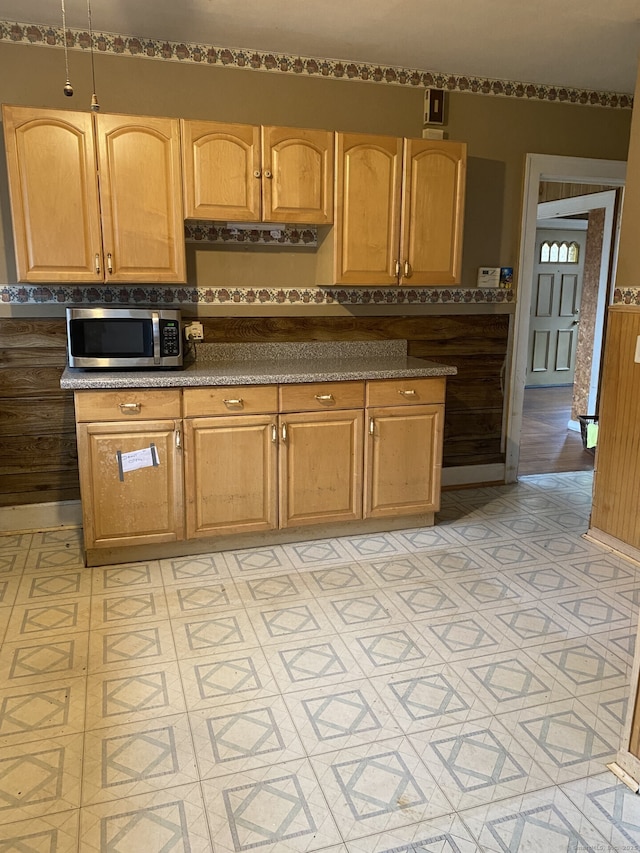 624 S Main St, Torrington, CT 06790 - kitchen with stainless steel microwave, dark countertops, and light floors