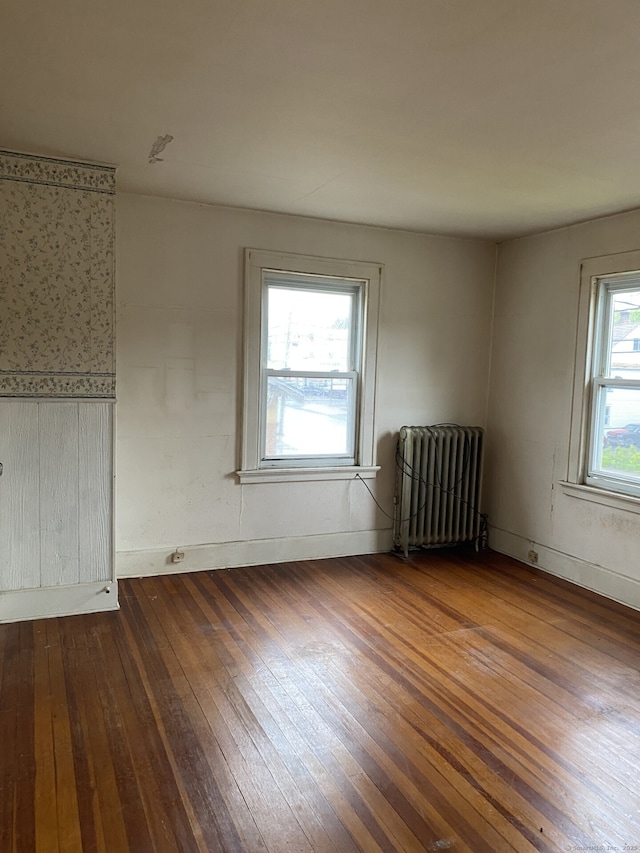 624 S Main St, Torrington, CT 06790 - unfurnished room featuring radiator, hardwood / wood-style flooring, and baseboards