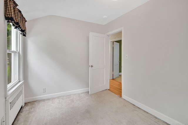 172 S Rd, Marlborough, CT 06447 - unfurnished room with radiator heating unit, baseboards, plenty of natural light, light carpet, and lofted ceiling