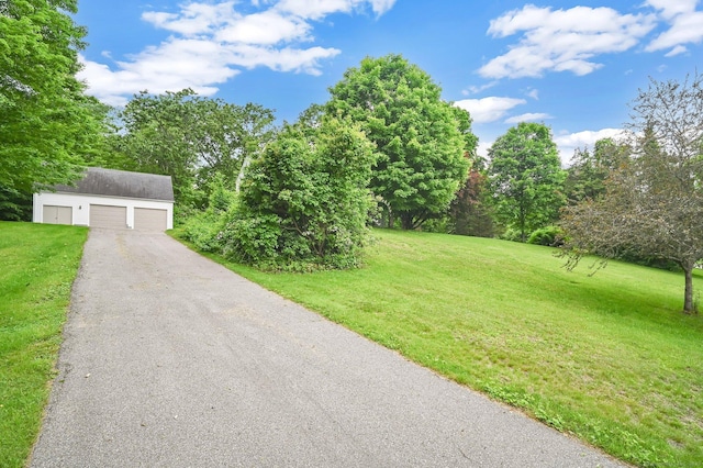 172 S Rd, Marlborough, CT 06447 - view of front of home featuring an outdoor structure, a front lawn, and a garage