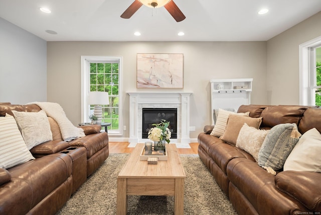 48 Evergreen Rd, Cromwell, CT 06416 - living room with recessed lighting, ceiling fan, light wood finished floors, and a fireplace with flush hearth