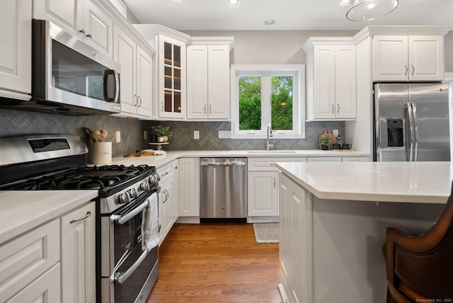 48 Evergreen Rd, Cromwell, CT 06416 - kitchen featuring stainless steel appliances, a sink, recessed lighting, white cabinets, and light wood finished floors