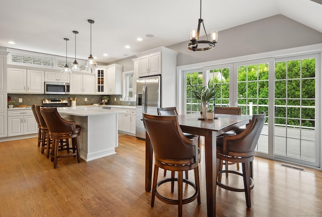 48 Evergreen Rd, Cromwell, CT 06416 - dining area with light wood-type flooring, a chandelier, recessed lighting, and vaulted ceiling
