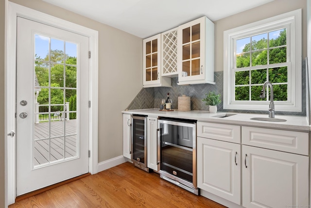 48 Evergreen Rd, Cromwell, CT 06416 - indoor dry bar with beverage cooler, healthy amount of natural light, and light wood-type flooring