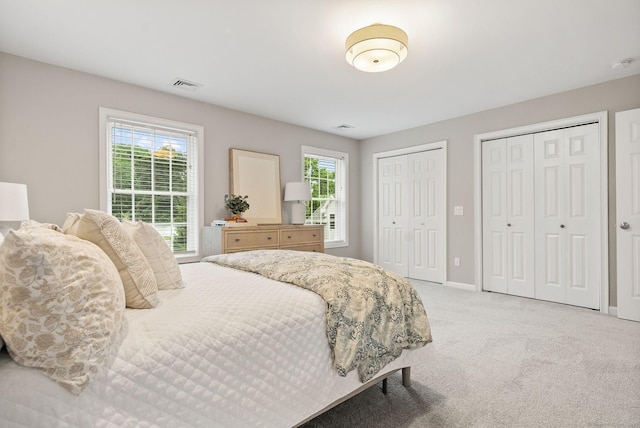 48 Evergreen Rd, Cromwell, CT 06416 - bedroom with multiple closets, light carpet, and baseboards