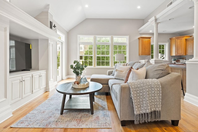 48 Evergreen Rd, Cromwell, CT 06416 - living room with decorative columns, healthy amount of natural light, light wood-style floors, vaulted ceiling, and recessed lighting