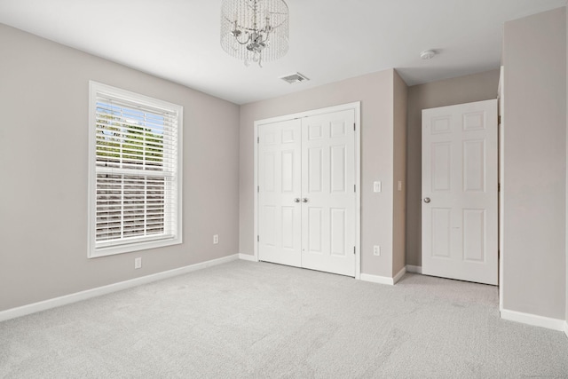 48 Evergreen Rd, Cromwell, CT 06416 - unfurnished bedroom with carpet floors, a chandelier, a closet, and baseboards
