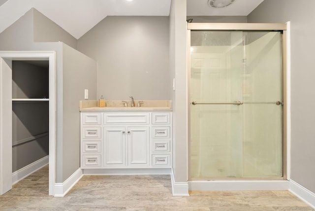 48 Evergreen Rd, Cromwell, CT 06416 - bathroom featuring a shower stall, baseboards, wood finished floors, vanity, and vaulted ceiling