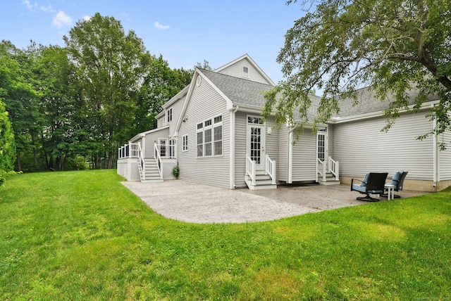 48 Evergreen Rd, Cromwell, CT 06416 - back of house featuring entry steps, a patio area, a yard, and a shingled roof