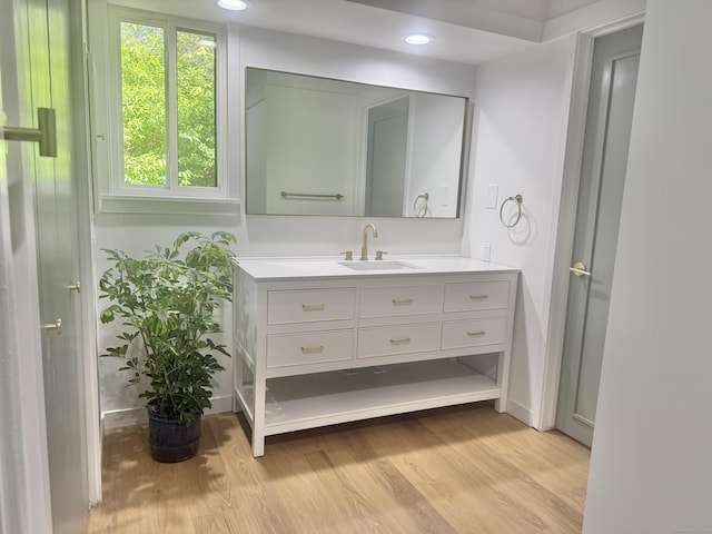 740 Heritage Vlg Unit B, Southbury, CT 06488 - bathroom with vanity, wood finished floors, recessed lighting, and baseboards