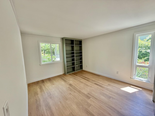 740 Heritage Vlg Unit B, Southbury, CT 06488 - spare room featuring light wood-style floors and baseboards