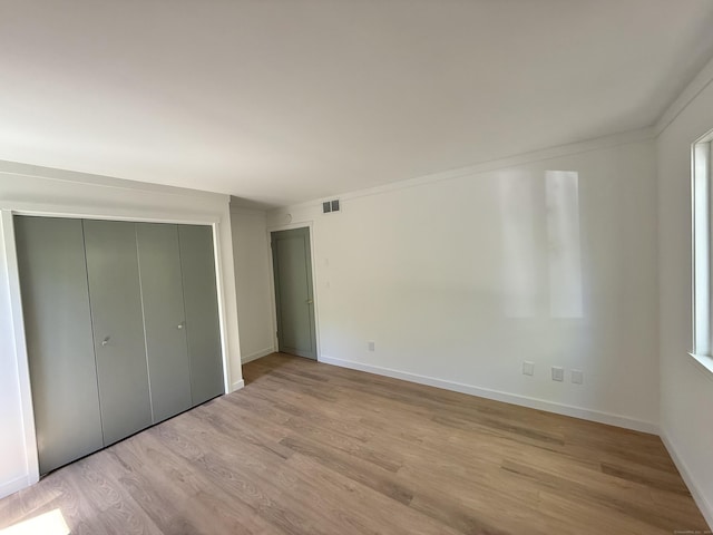 740 Heritage Vlg Unit B, Southbury, CT 06488 - unfurnished bedroom featuring wood finished floors, baseboards, and a closet