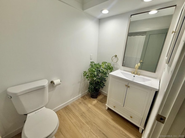 740 Heritage Vlg Unit B, Southbury, CT 06488 - bathroom featuring vanity, baseboards, toilet, wood finished floors, and recessed lighting