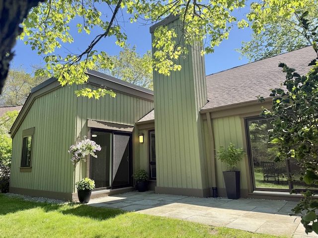 740 Heritage Vlg Unit B, Southbury, CT 06488 - view of front of property featuring a shingled roof, a front lawn, and a patio area