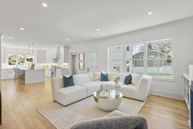 15 Barton Rd, Fairfield, CT 06824 - living room featuring ornamental molding, light wood finished floors, recessed lighting, and baseboards