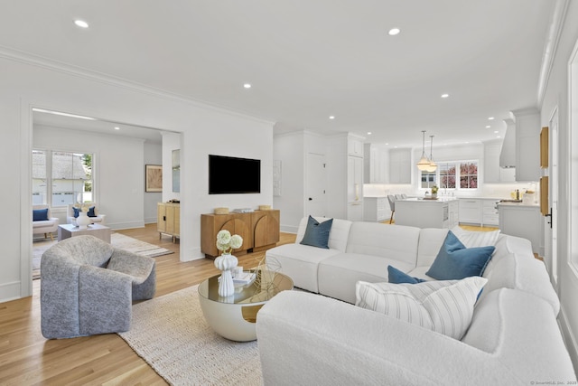 15 Barton Rd, Fairfield, CT 06824 - living room featuring ornamental molding, healthy amount of natural light, light wood-style flooring, recessed lighting, and baseboards