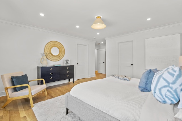 15 Barton Rd, Fairfield, CT 06824 - bedroom with crown molding, light wood-style floors, recessed lighting, baseboards, and two closets