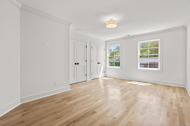 15 Barton Rd, Fairfield, CT 06824 - unfurnished bedroom featuring ornamental molding, multiple closets, light wood-style flooring, and baseboards