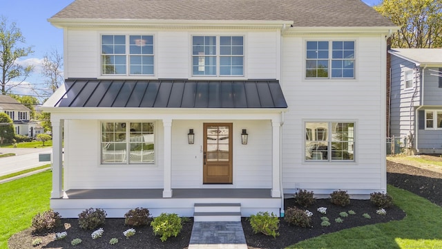15 Barton Rd, Fairfield, CT 06824 - view of front of home with covered porch, a standing seam roof, and a shingled roof