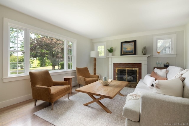 331 Calkinstown Rd, Sharon, CT 06069 - living area featuring healthy amount of natural light, wood finished floors, baseboards, and a brick fireplace