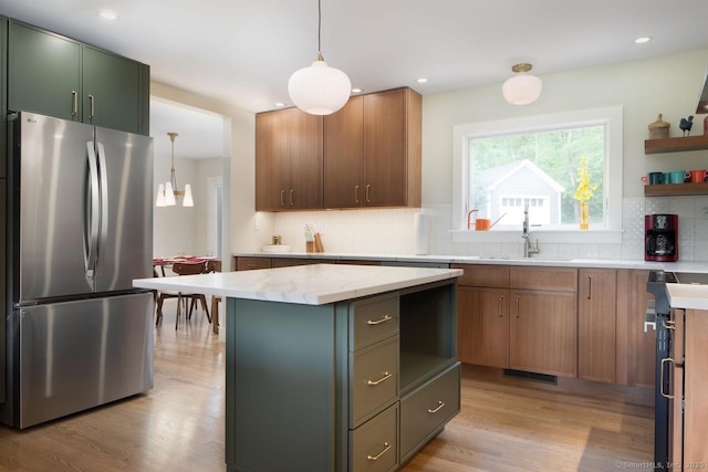 331 Calkinstown Rd, Sharon, CT 06069 - kitchen featuring freestanding refrigerator, light wood-style floors, decorative backsplash, a sink, and a center island