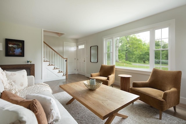 331 Calkinstown Rd, Sharon, CT 06069 - living area with stairs, light wood-style floors, and baseboards