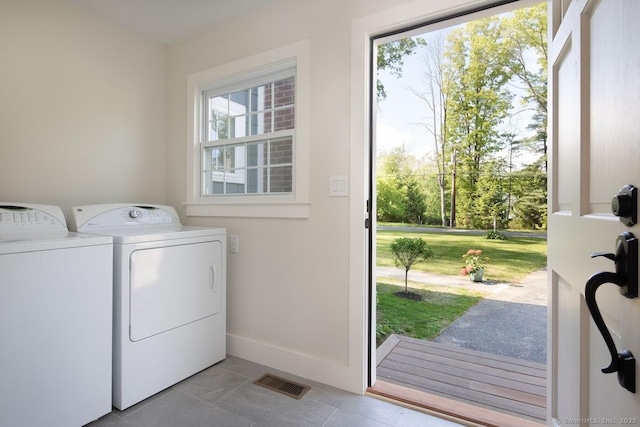 331 Calkinstown Rd, Sharon, CT 06069 - laundry area with washing machine and clothes dryer, light tile patterned floors, and baseboards