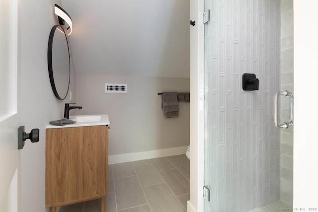 331 Calkinstown Rd, Sharon, CT 06069 - bathroom with vanity, vaulted ceiling, toilet, a shower, and tile patterned floors