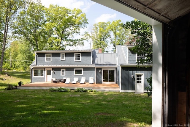 331 Calkinstown Rd, Sharon, CT 06069 - rear view of house featuring a lawn, a deck, board and batten siding, and a chimney