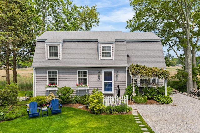 55 Cypress Rd, Old Saybrook, CT 06475 - view of front facade featuring a front yard, a gambrel roof, and roof with shingles