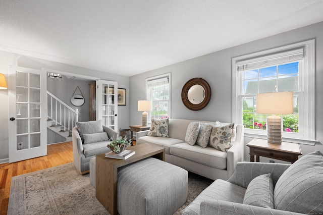 55 Cypress Rd, Old Saybrook, CT 06475 - living area featuring stairway and wood finished floors