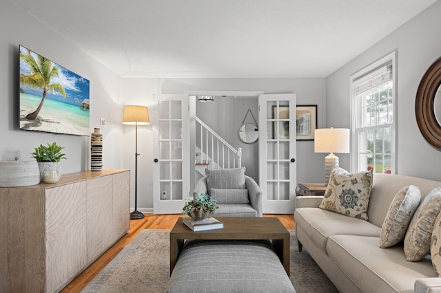 55 Cypress Rd, Old Saybrook, CT 06475 - living room featuring light wood finished floors and stairs