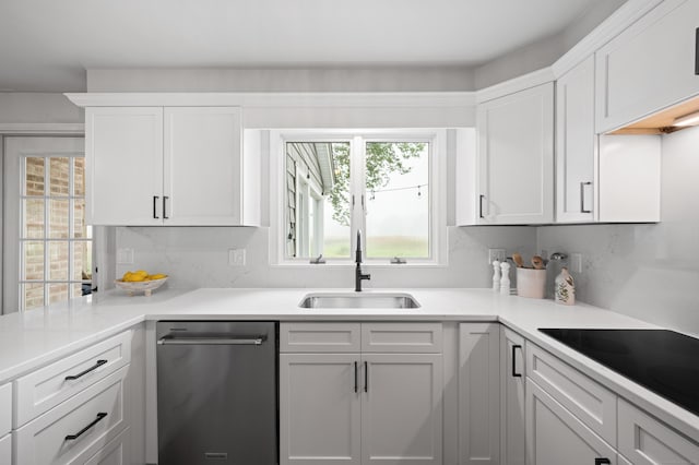 55 Cypress Rd, Old Saybrook, CT 06475 - kitchen with black electric cooktop, stainless steel dishwasher, light countertops, and white cabinets